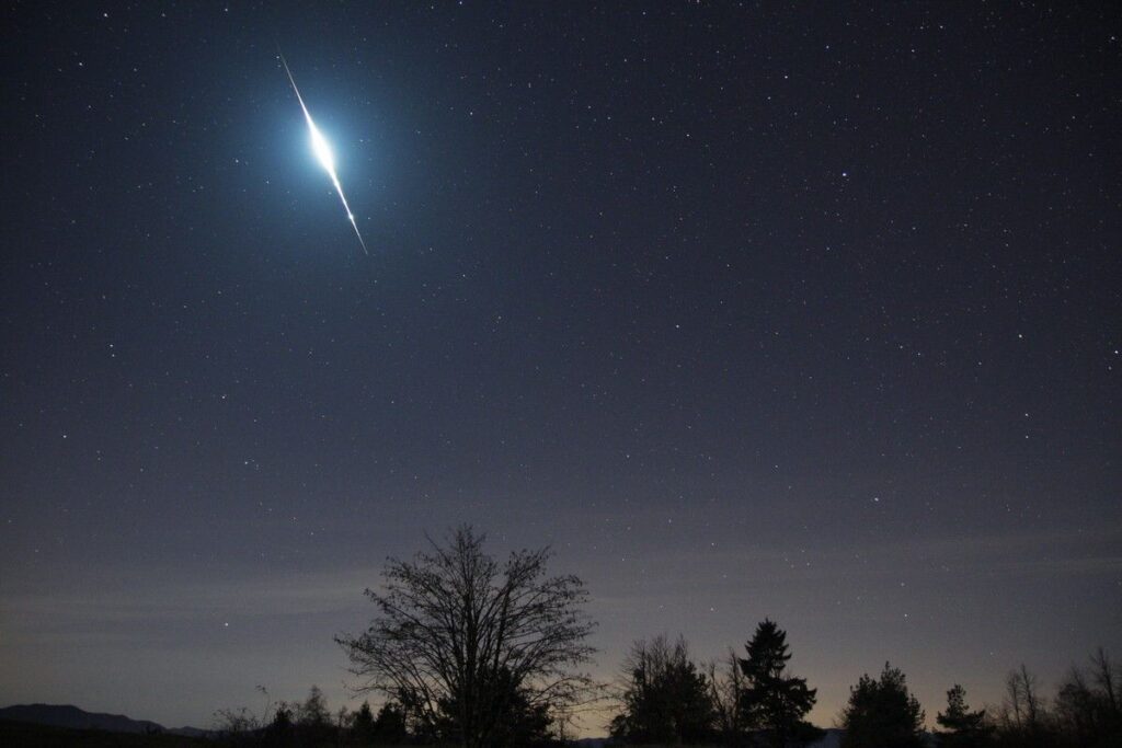 Brilliant blue -15 Taurid fireball in Pegasus, illuminating the sky and clouds.